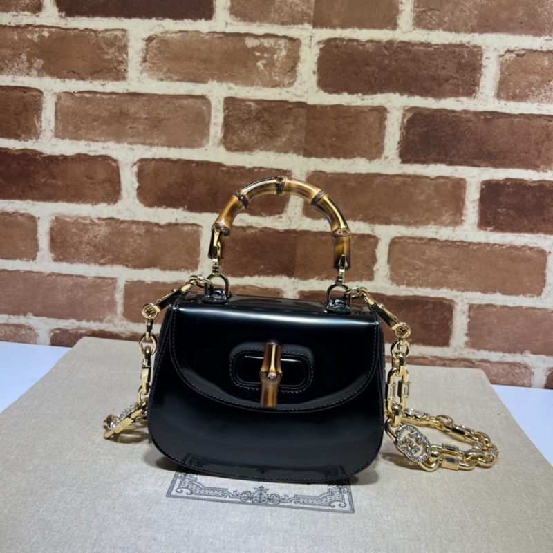 G*u*i top handle bags